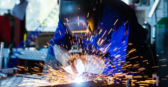 Welder welding with sparks